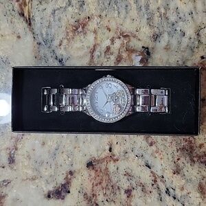Avon floating charm watch
